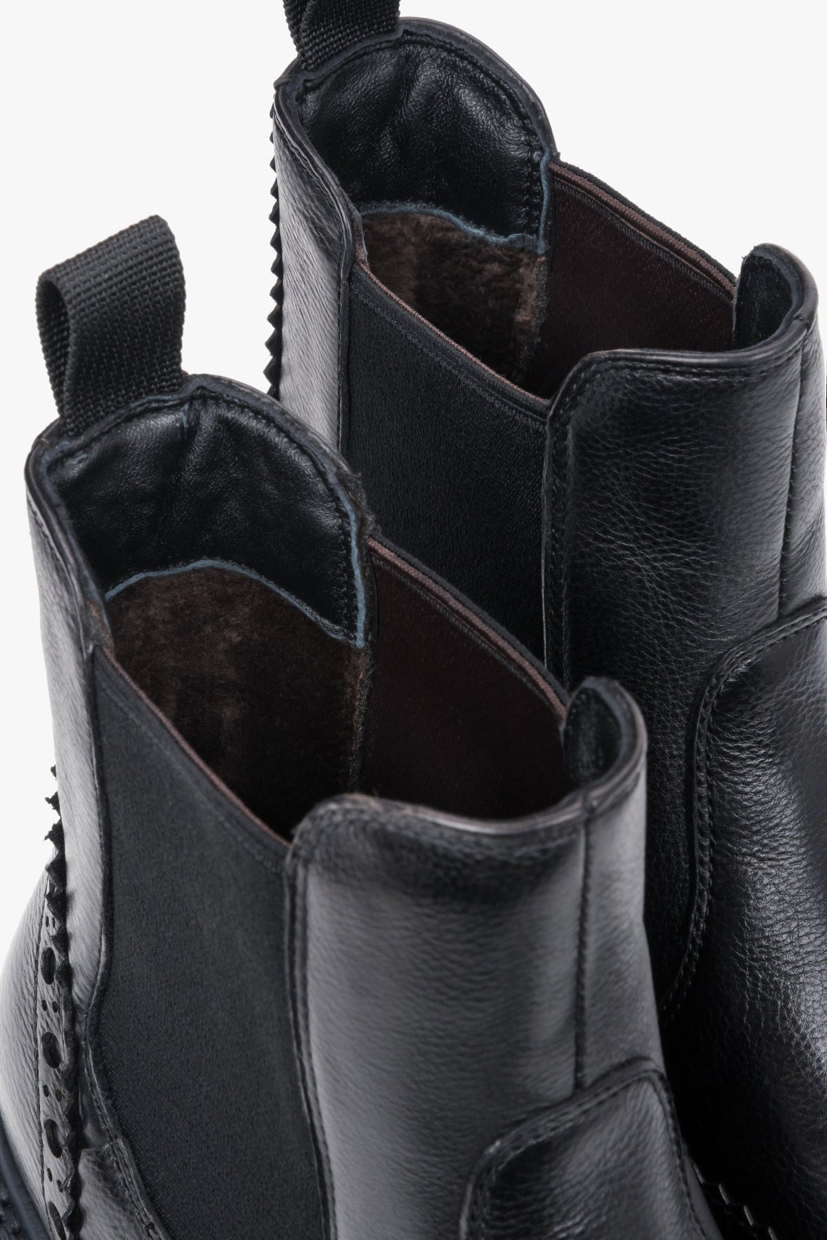 Estro - women's black leather Chelsea boots on a thick sole with brogue perforation.