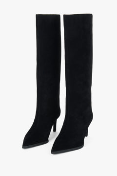 Side profile highlighting the tall shaft and sleek high-heeled design.