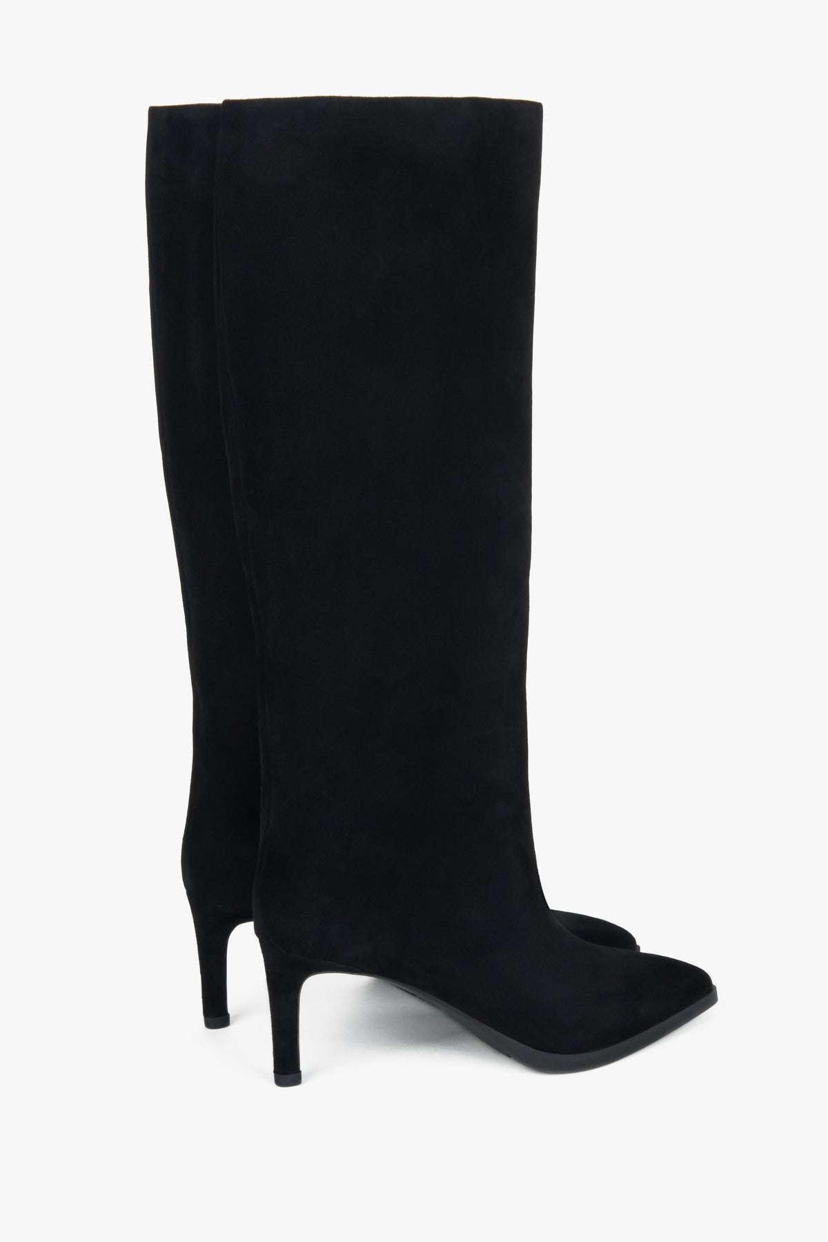Full-length shot presenting the sophisticated fit and timeless women's boots style.