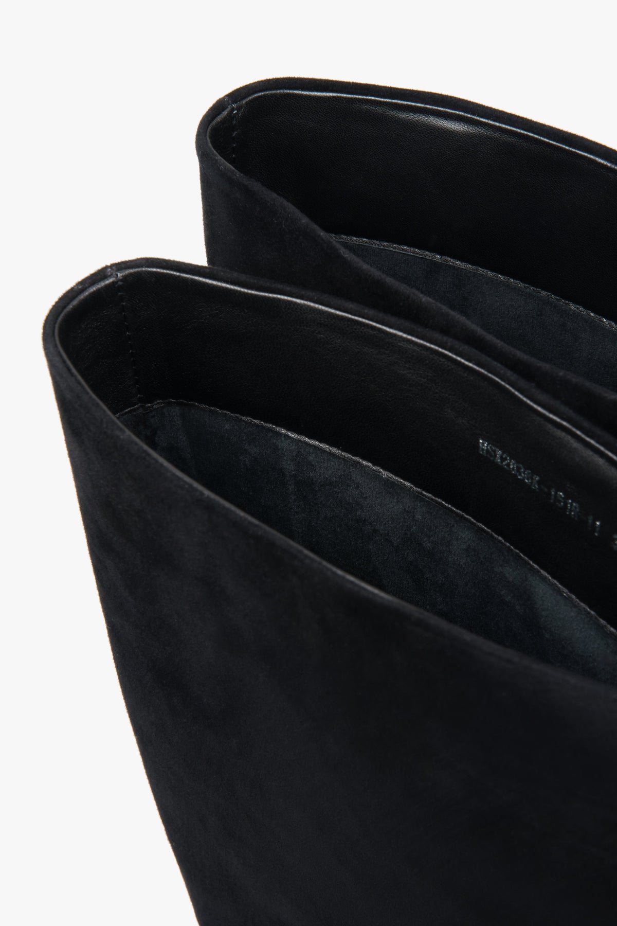 Detailed view highlighting the refined heel craftsmanship and premium velour finish.