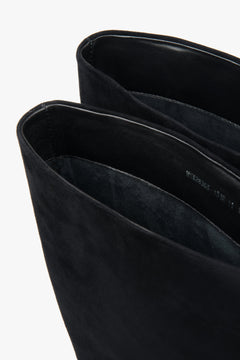 Detailed view highlighting the refined heel craftsmanship and premium velour finish.