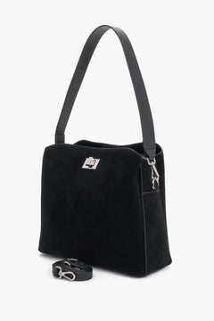 Women's black natural suede shoulder bag featuring an elegant metallic turn-lock closure, Estro.
