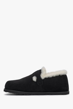 Women's black natural suede slip-on loafers featuring plush fur lining and an elegant front buckle, Estro.