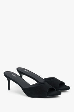 Angled view of women's black genuine velour mules with heel