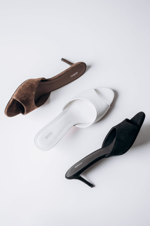 Lifestyle image showing women's heeled mules by Estro in different colours