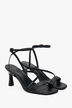 Black women’s heeled sandals in genuine leather.
