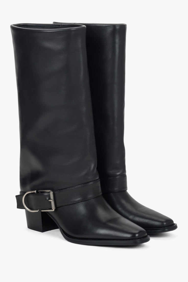 Black women’s high cowboy boots made of natural leather with buckle.