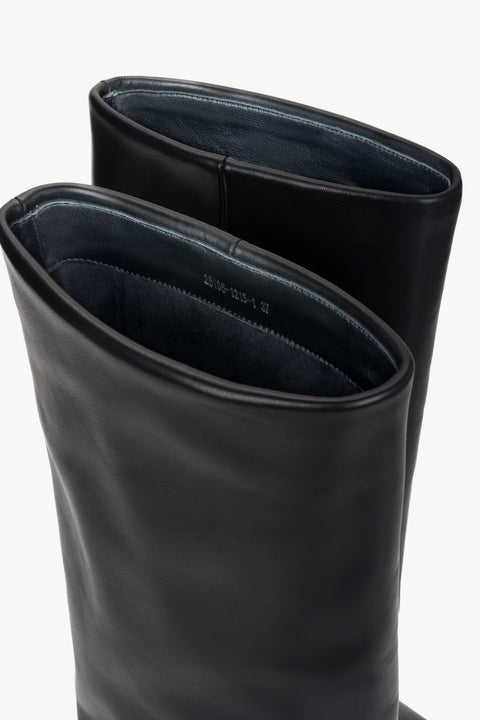 Women’s high cowboy boots made of natural leather with buckle.