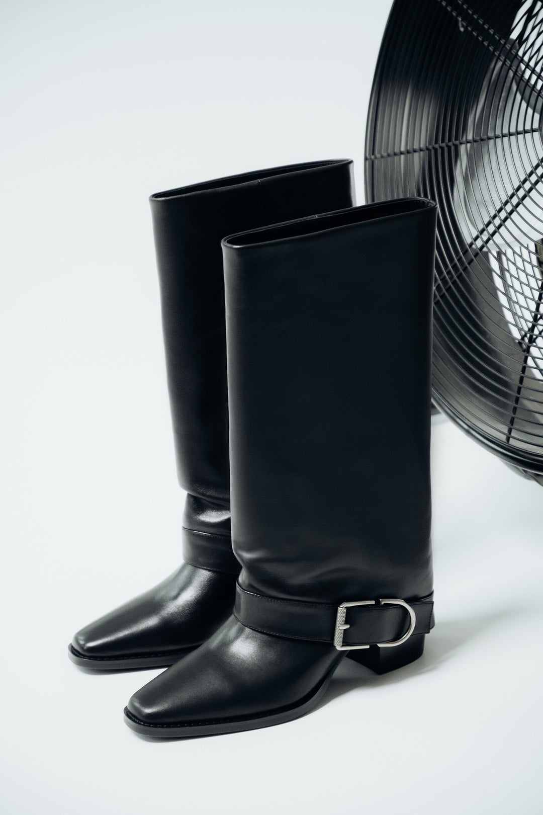 Women’s black high cowboy boots made of natural leather with buckle Estro.