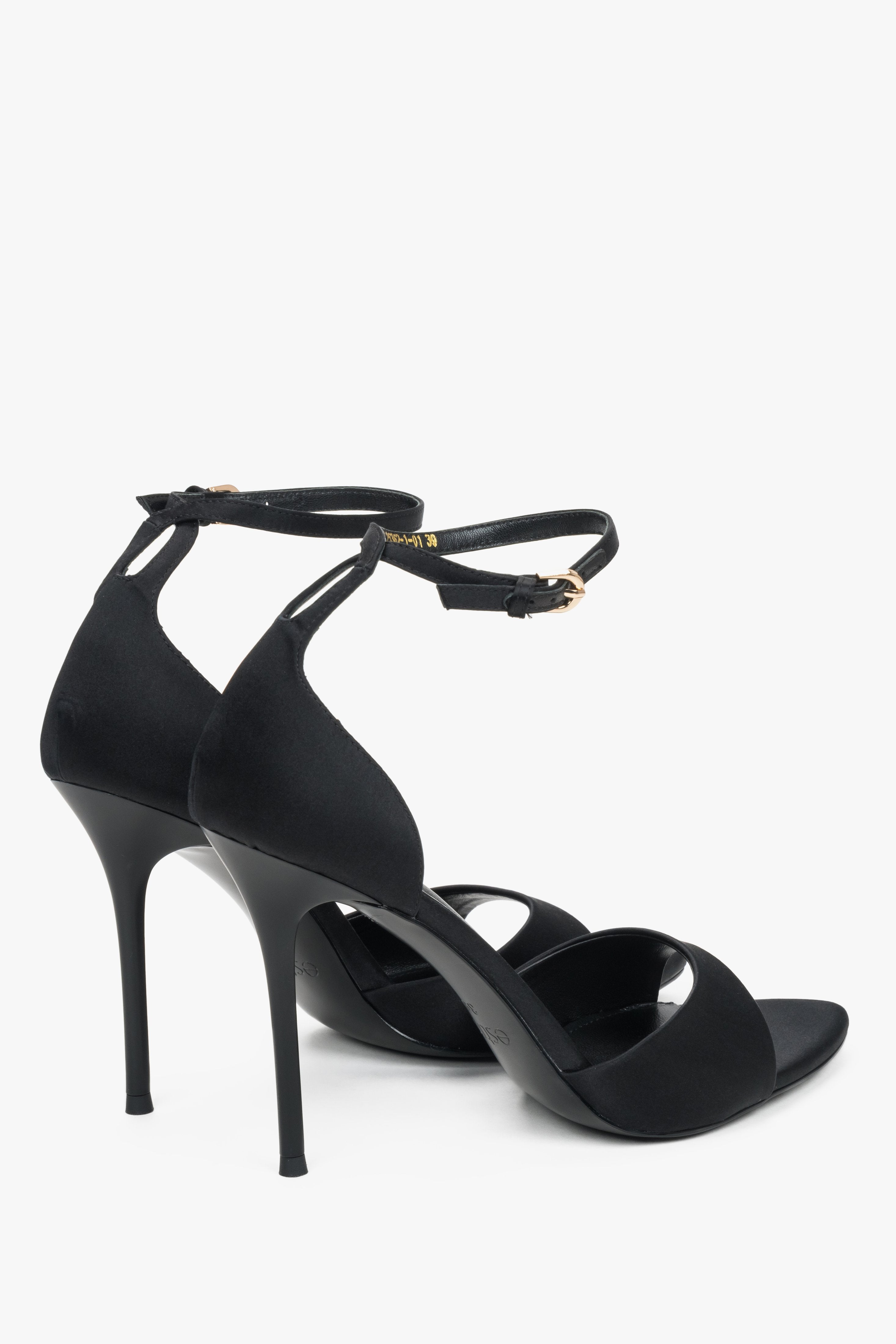Black high heel sandal with ankle strap and feather trim by Estro