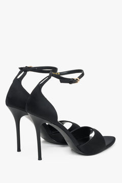 Black high heel sandal with ankle strap and feather trim by Estro