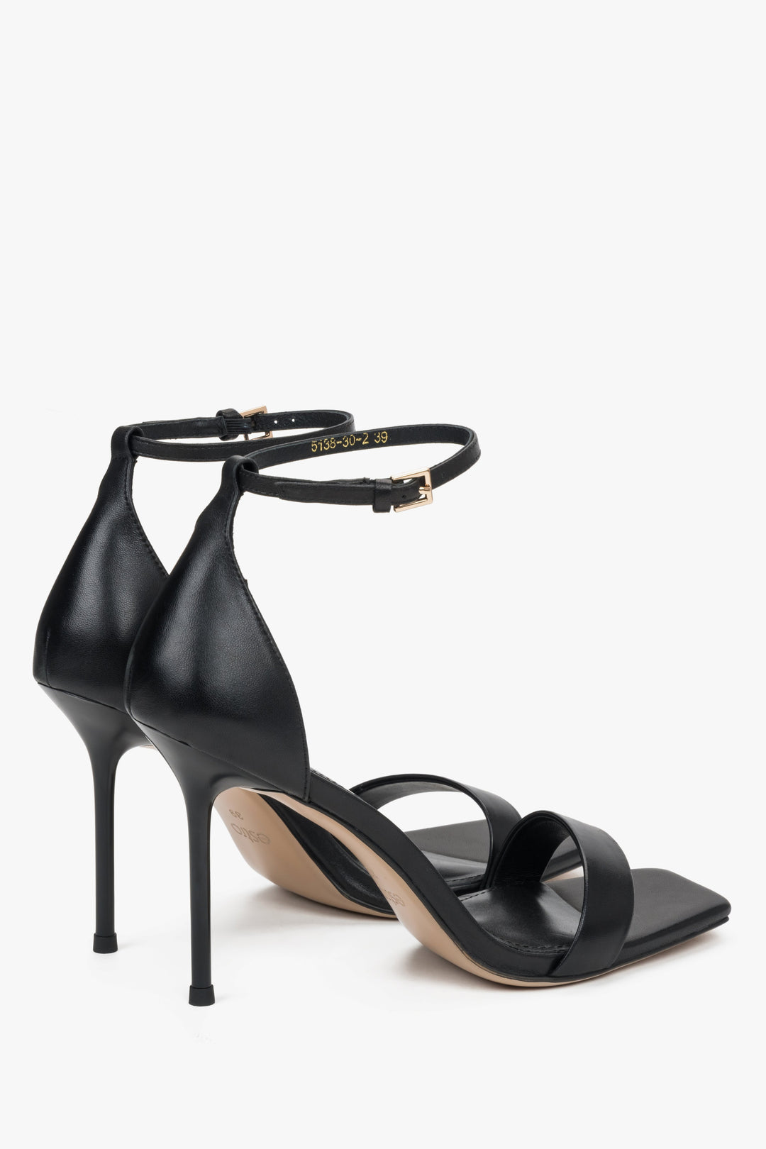 Solid enclosed heel counter and a buckle strap, ensuring security with every step – heel view.