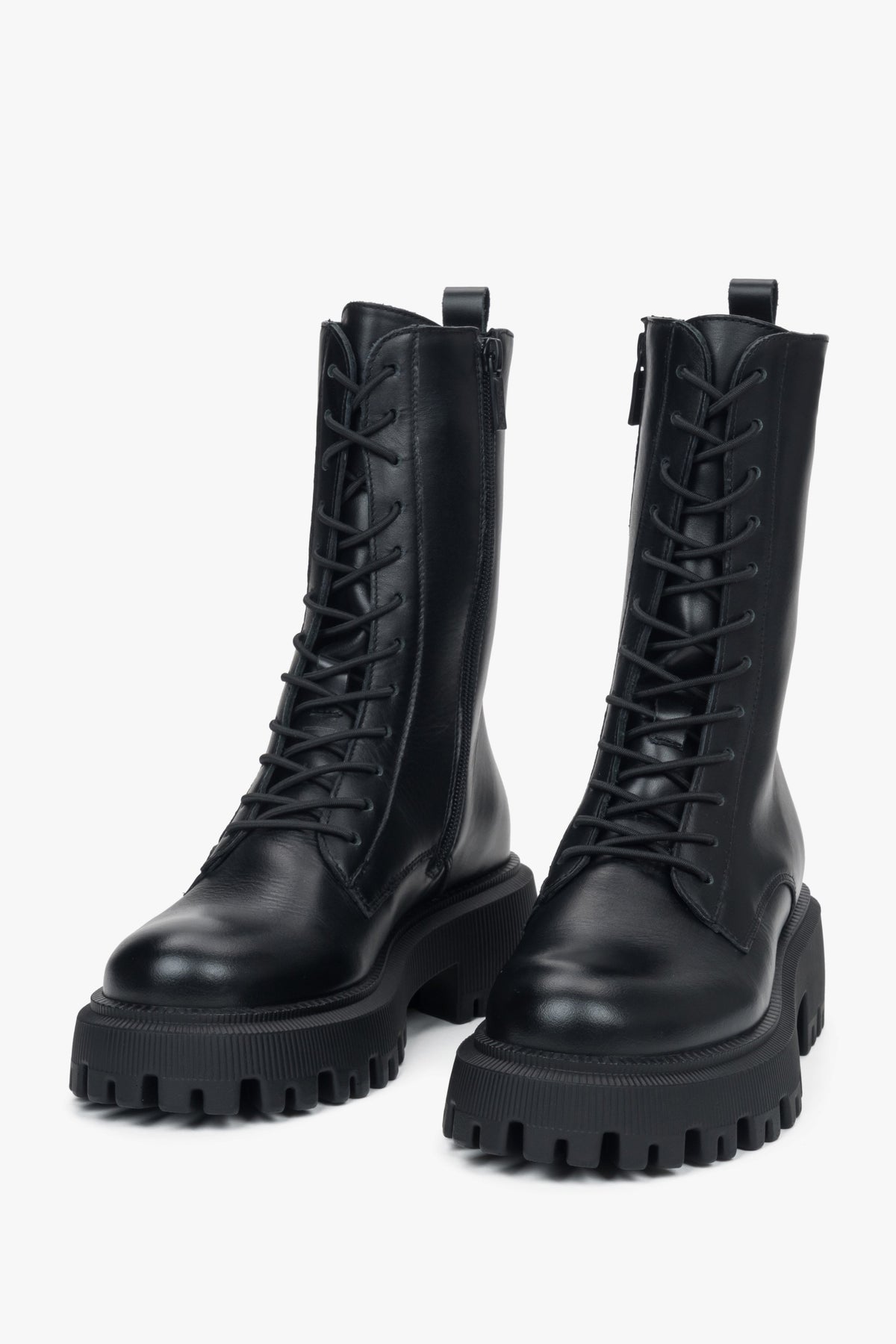 The high-top design adds modern edge and comfort, making these boots perfect for everyday wear.