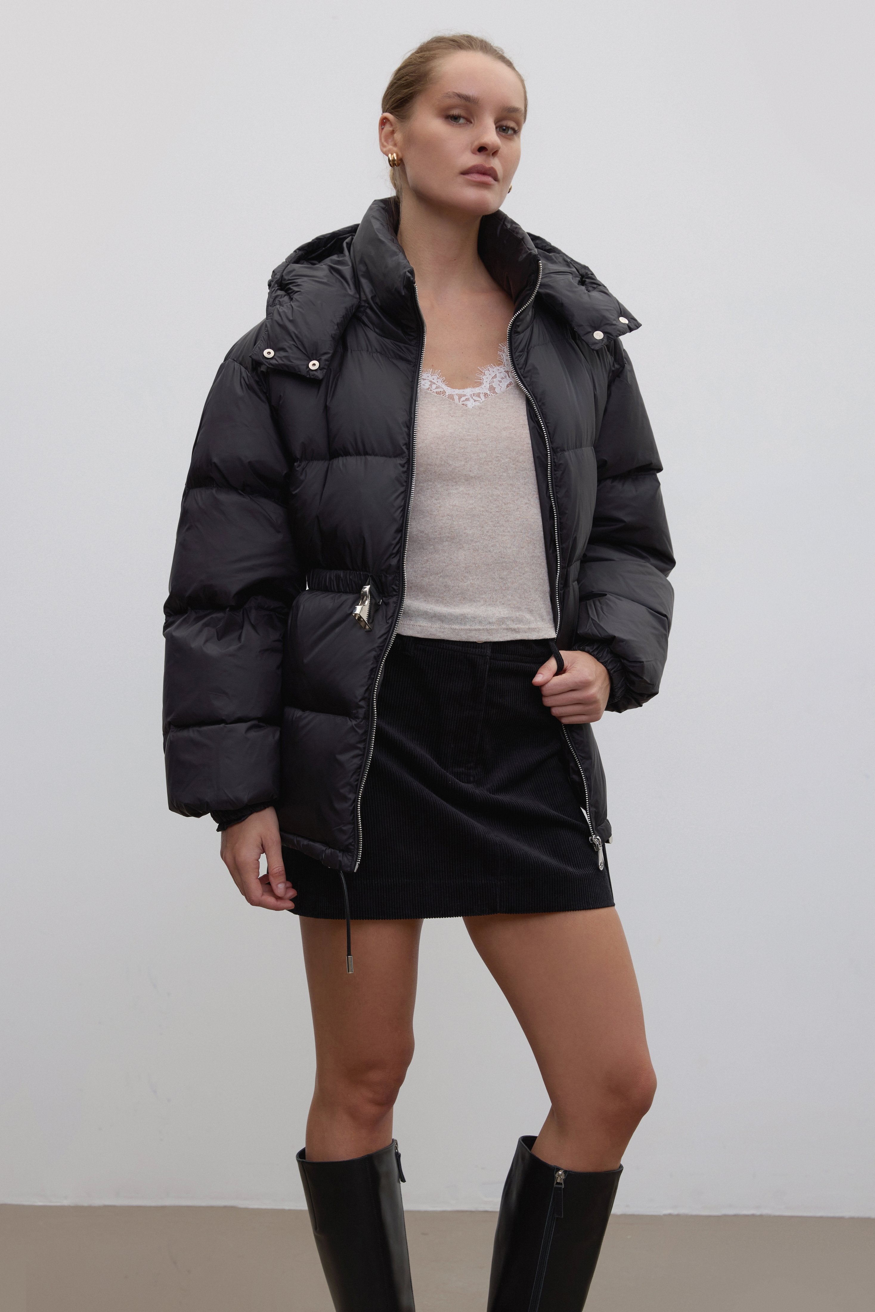 Black women's jacket by Estro, hip-length, with goose down and belt.