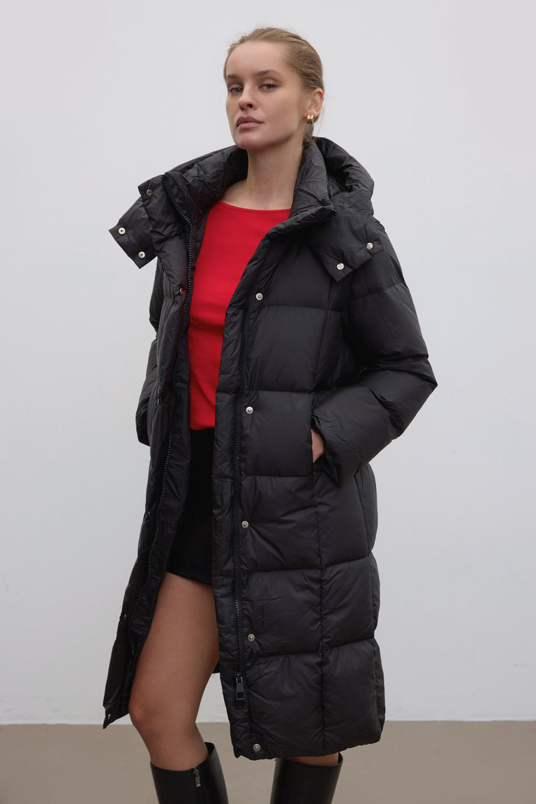 Black women’s winter jacket, knee length.