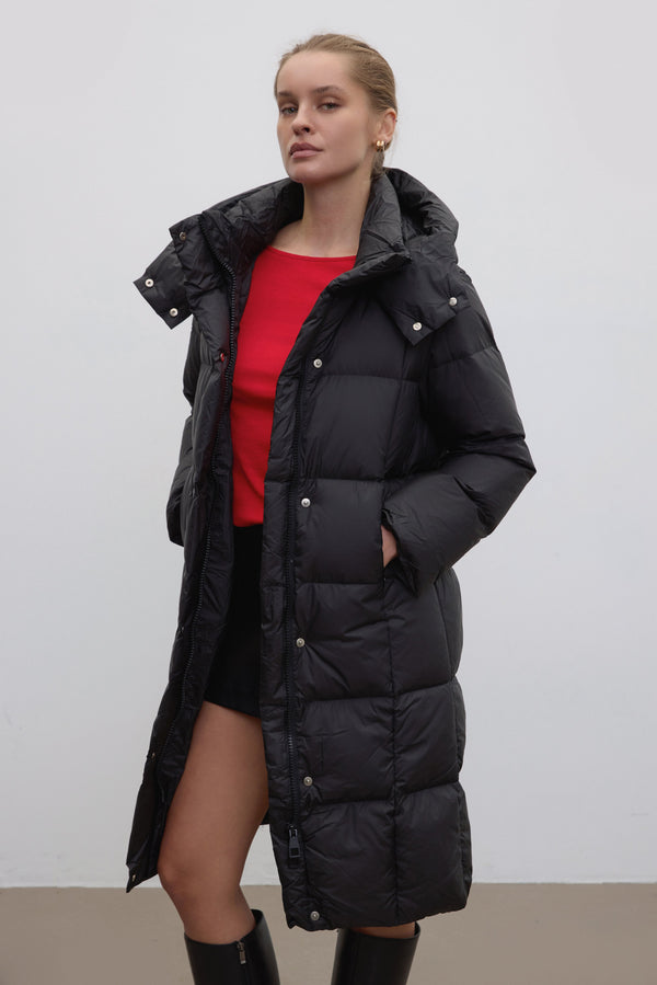 Black women’s winter jacket, knee length.