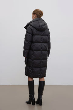 Women’s black knee-length winter jacket by Estro.