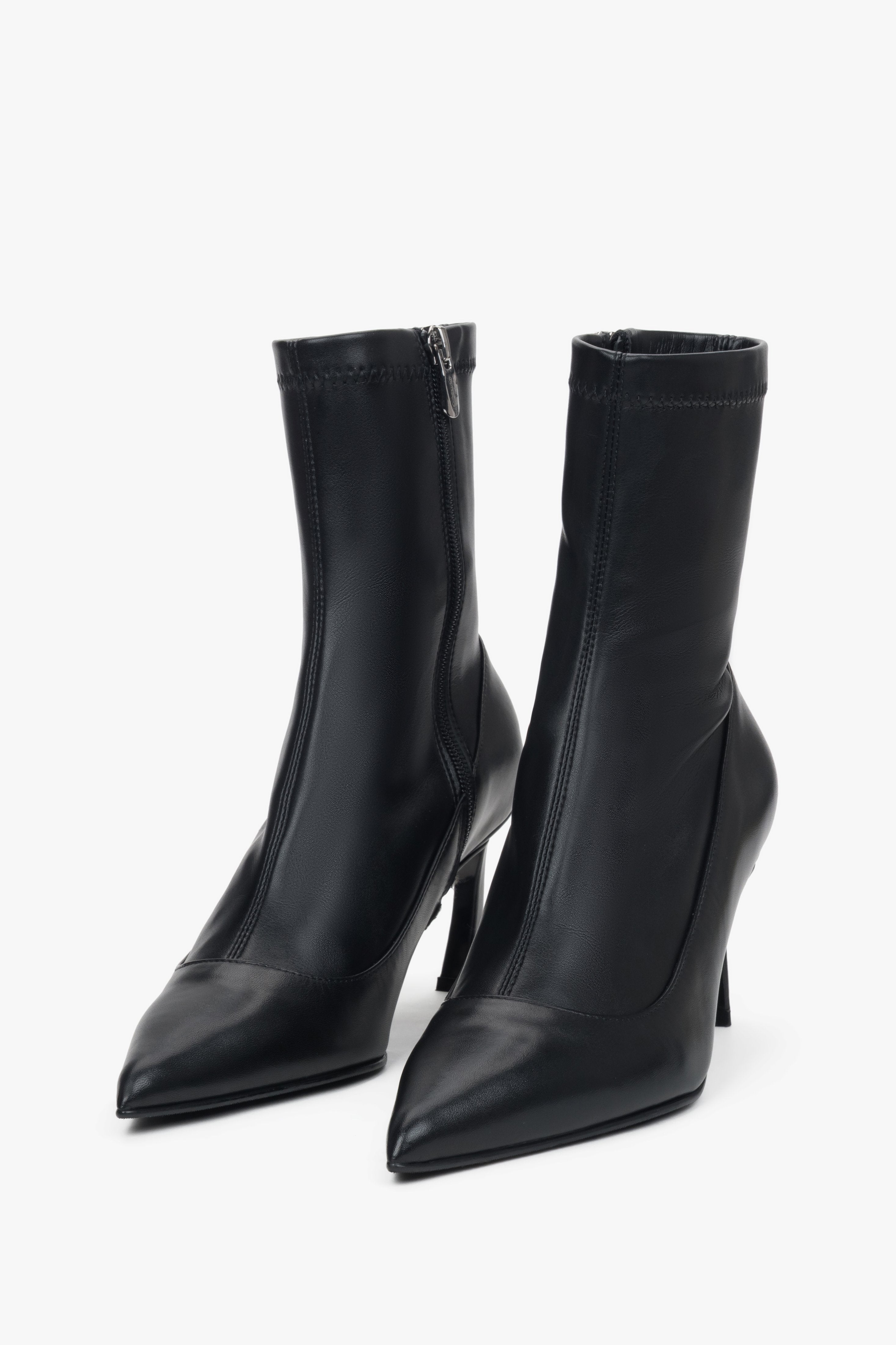 Women's black leather ankle boots with elastic shaft and stiletto heel by Estro.