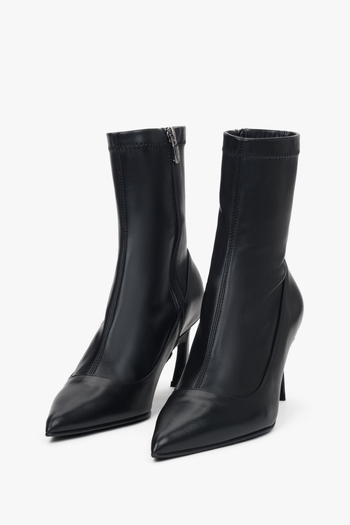 Women's black leather ankle boots with elastic shaft and stiletto heel by Estro.