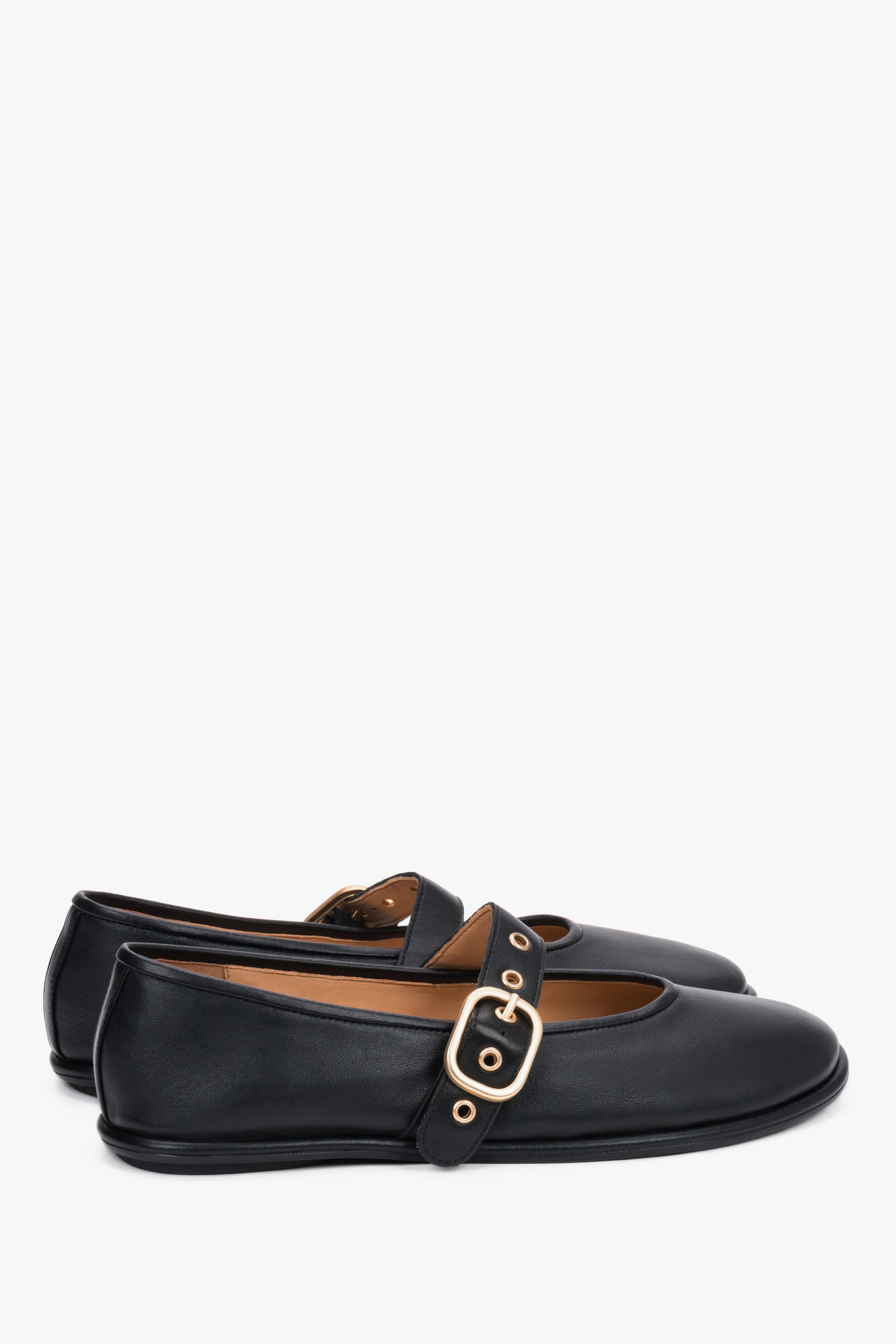 The back of the shoe showing the clean, precise stitching of the heel counter and the refined, minimalist silhouette.