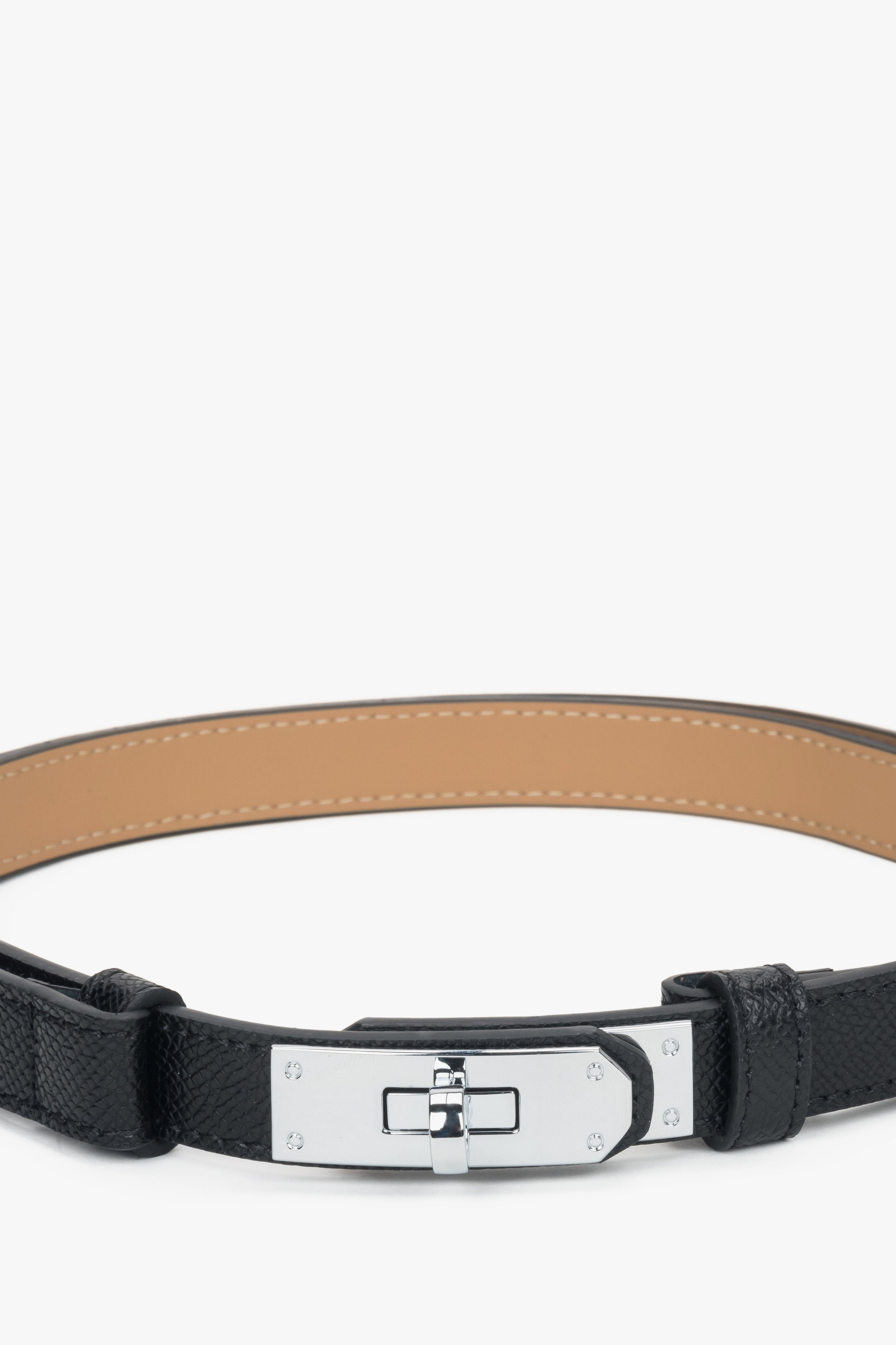 Women's black leather belt with a silver buckle.