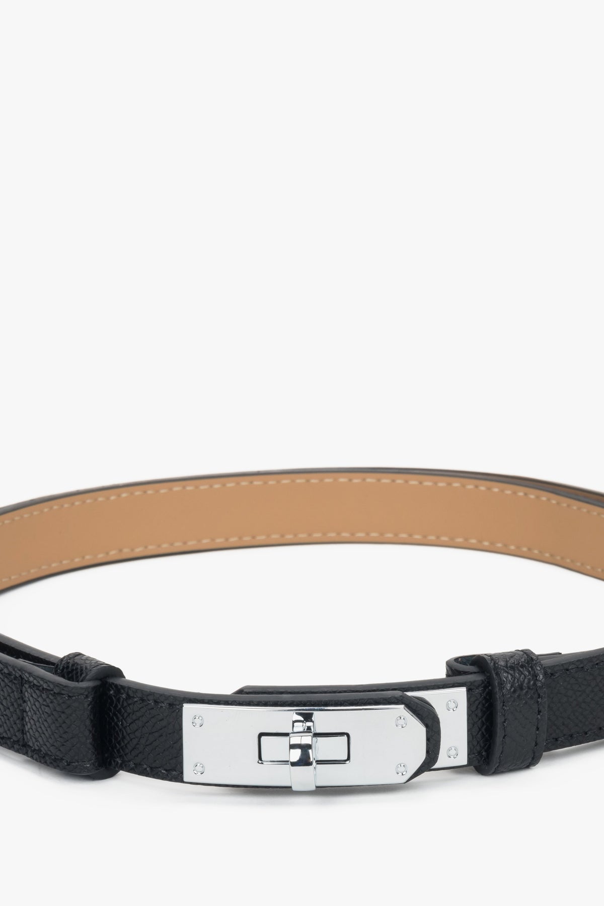 Women's black leather belt with a silver buckle.