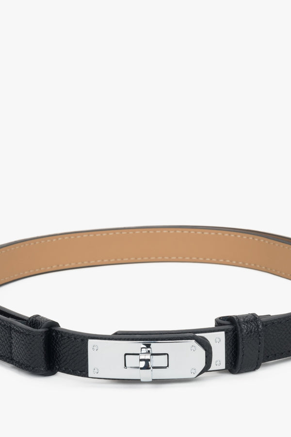 Women's black leather belt with a silver buckle.