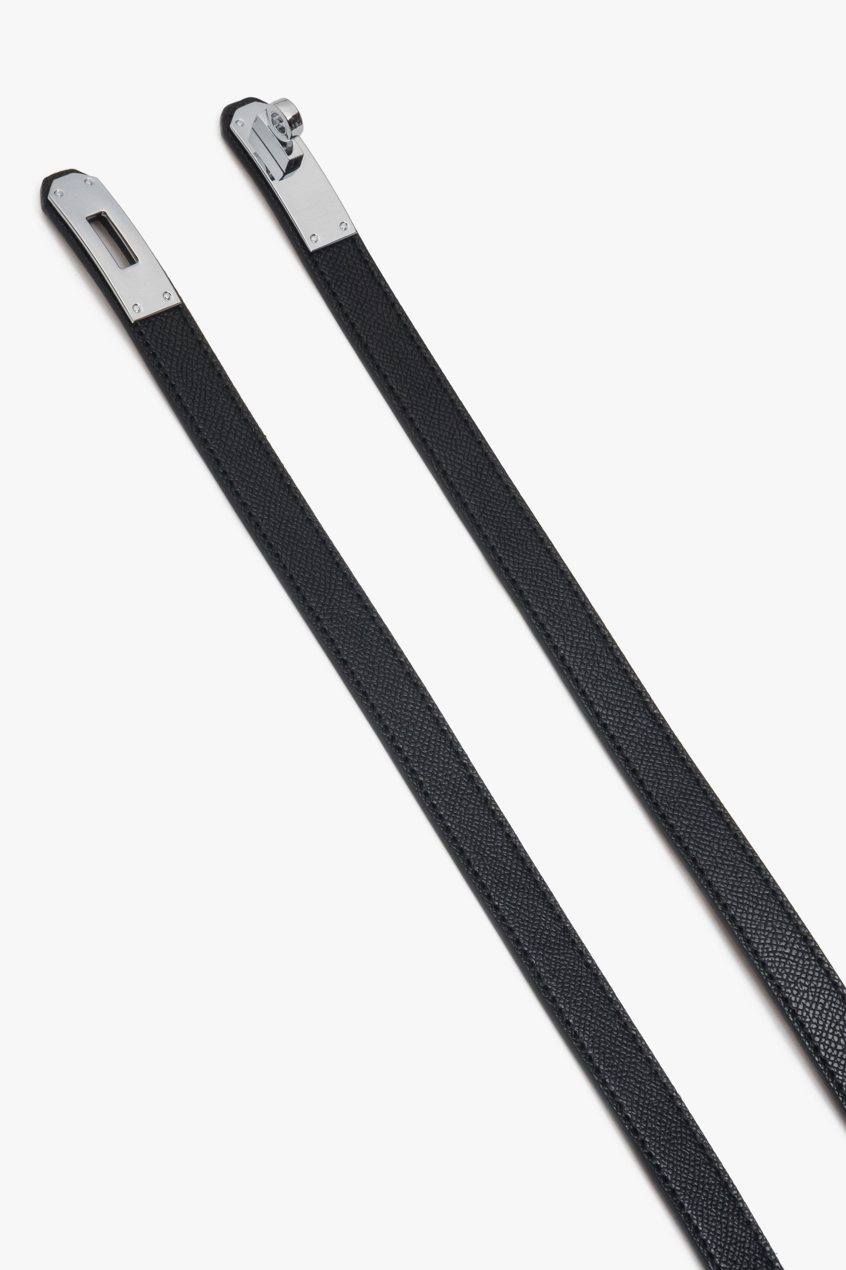 Black women's leather belt with a silver buckle.