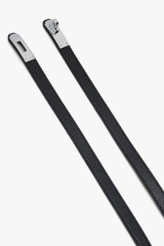 Black women's leather belt with a silver buckle.