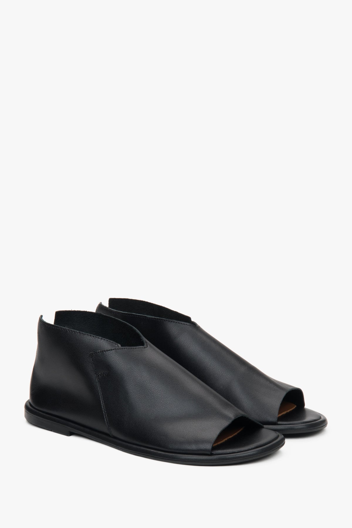 Women's black leather sandals from Estro, featuring a closed-heel design for added support.
