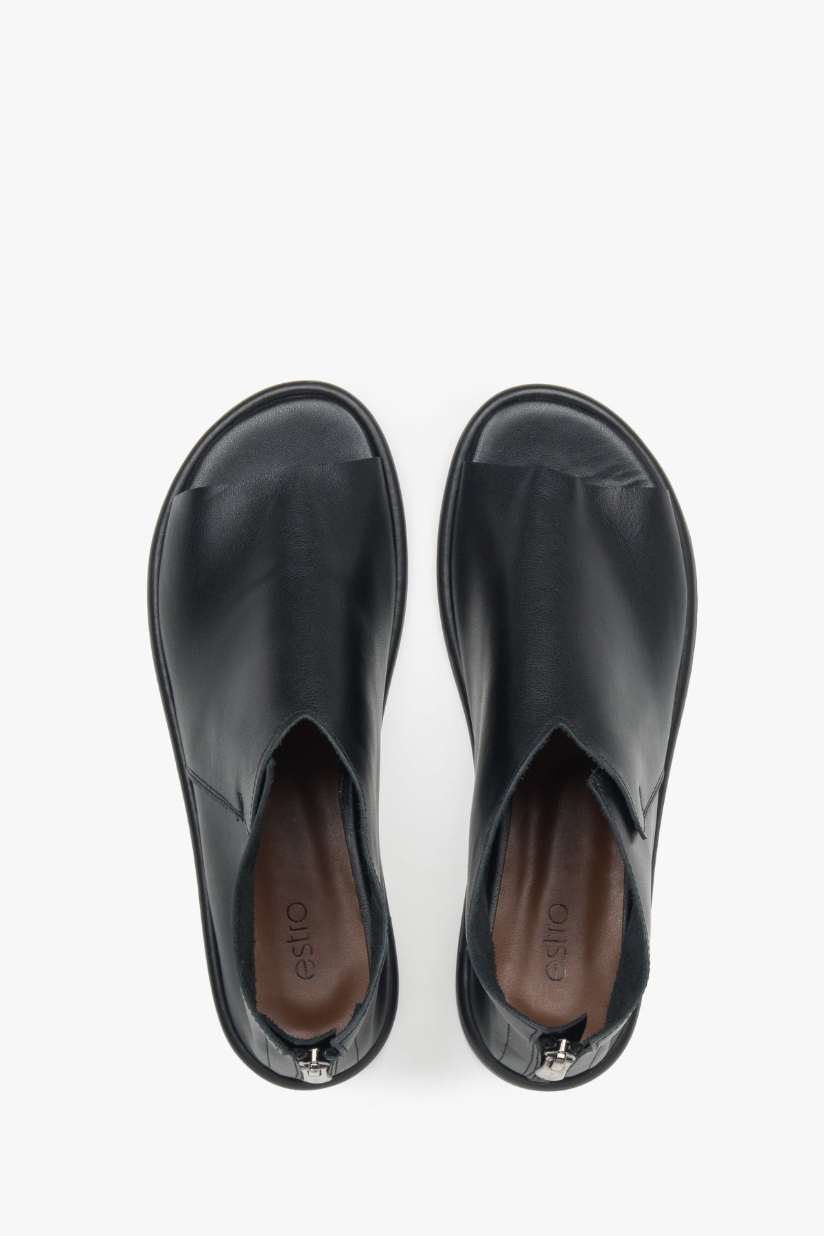 Stylish black leather sandals for women, featuring a closed-heel design for a refined and polished look.