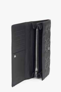 Elegant black leather women's wallet in a continental style from Estro.