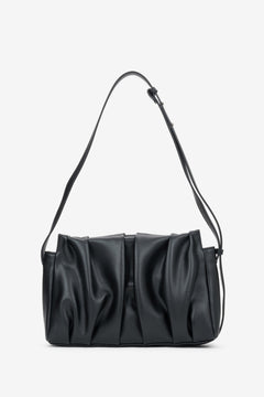 Women's black genuine leather crossbody messenger bag featuring elegant vertical ruched detail, Estro.