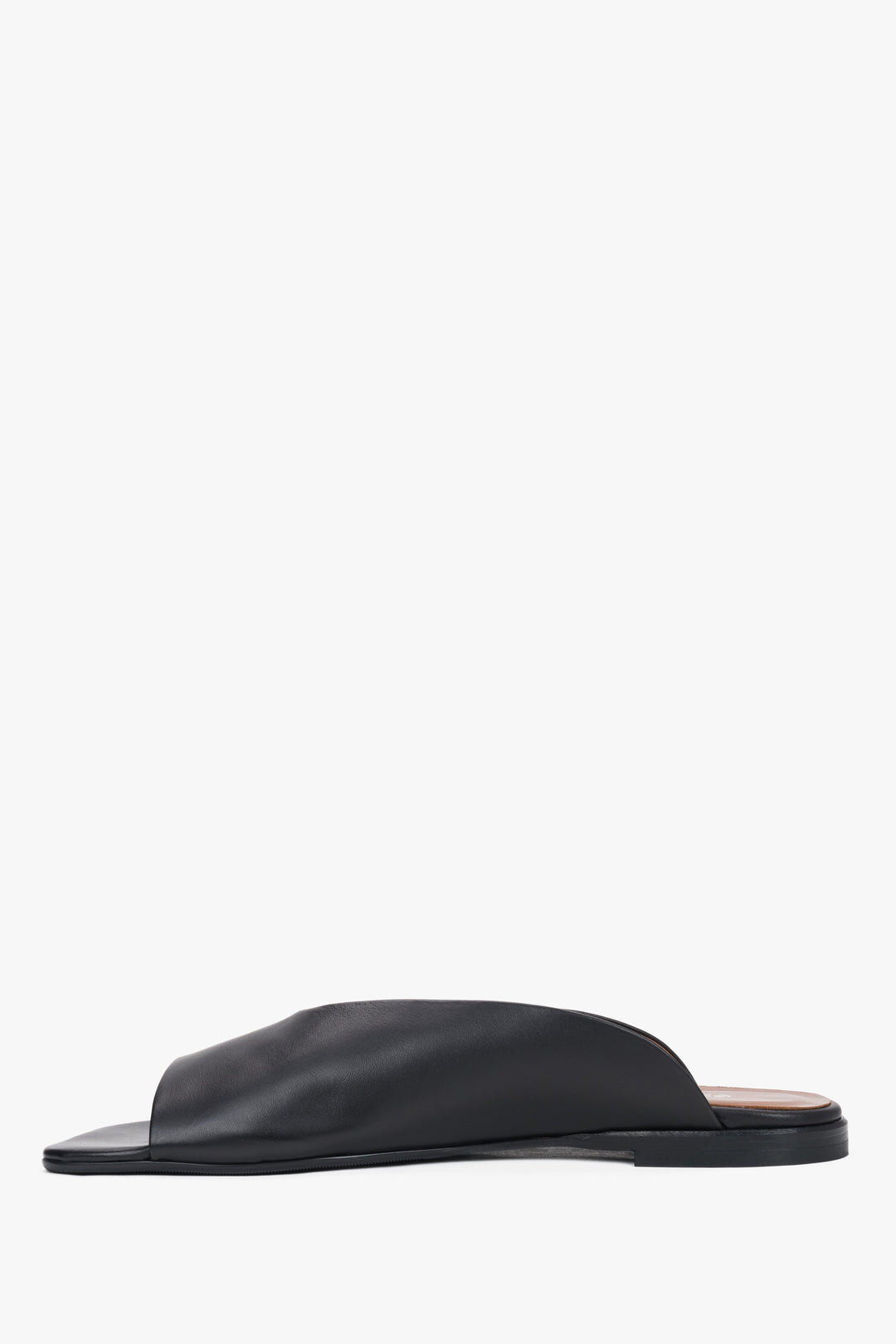 Side view of women's black leather flat mules by Estro
