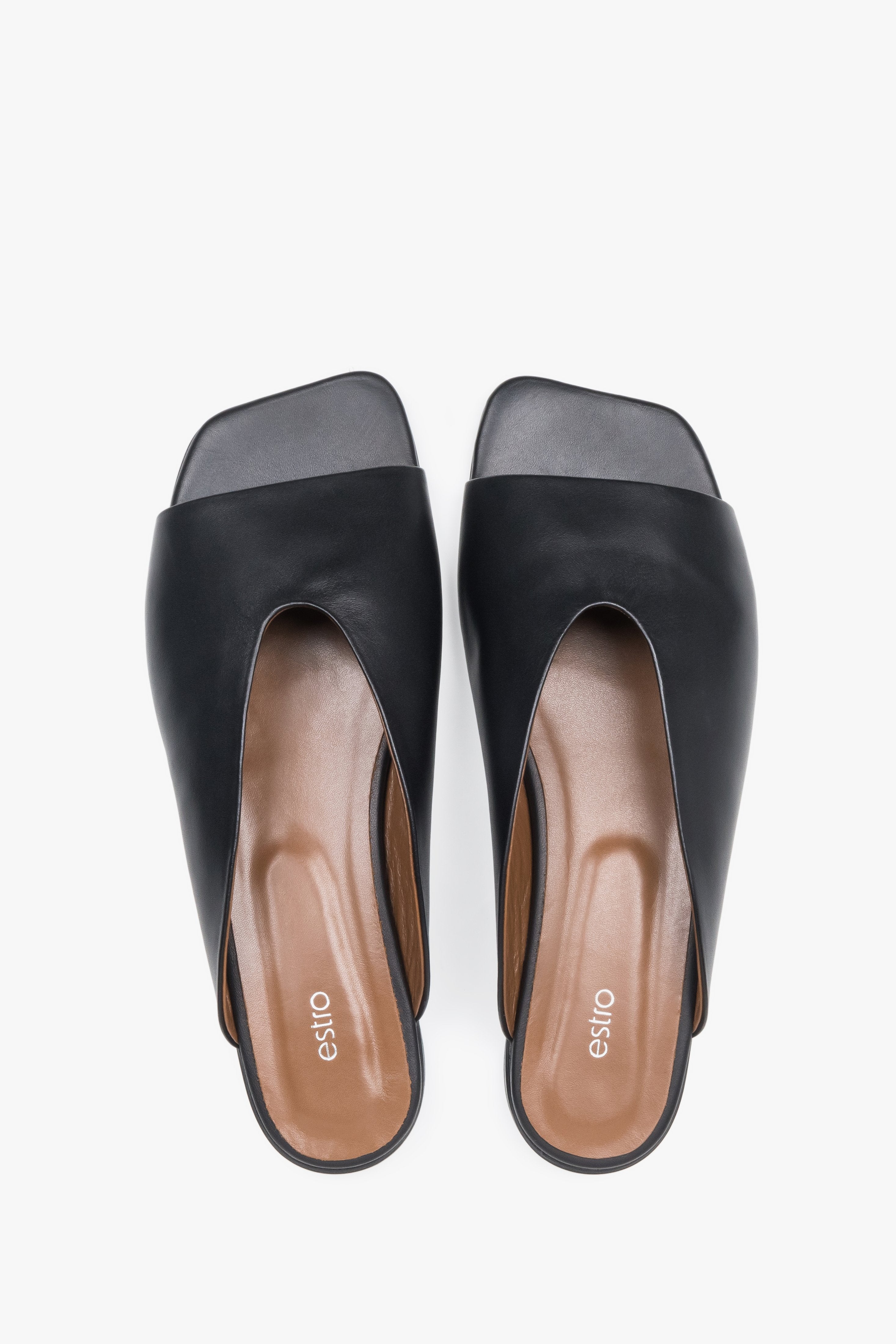 Top view of women's black leather flat mules by Estro
