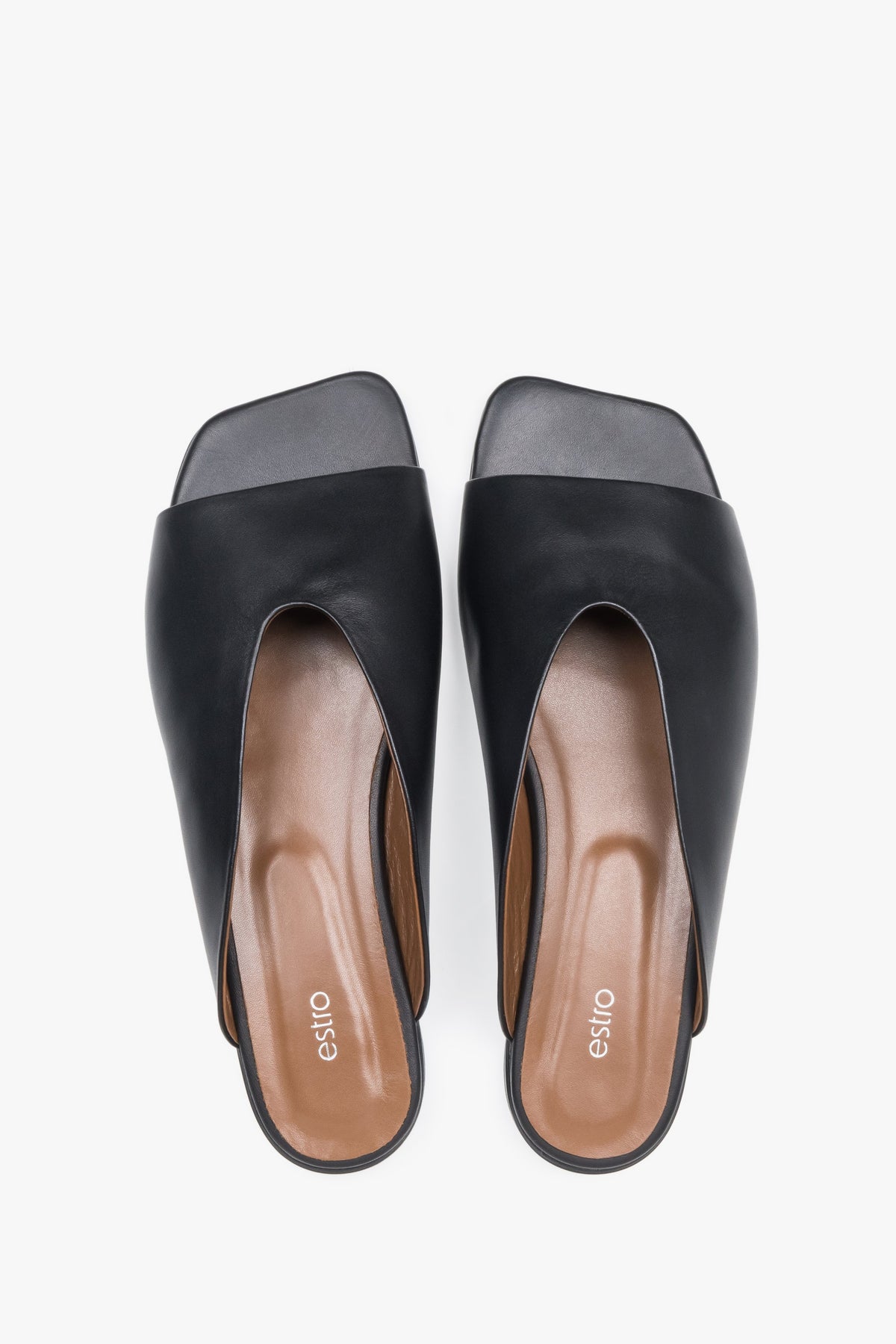 Top view of women's black leather flat mules by Estro