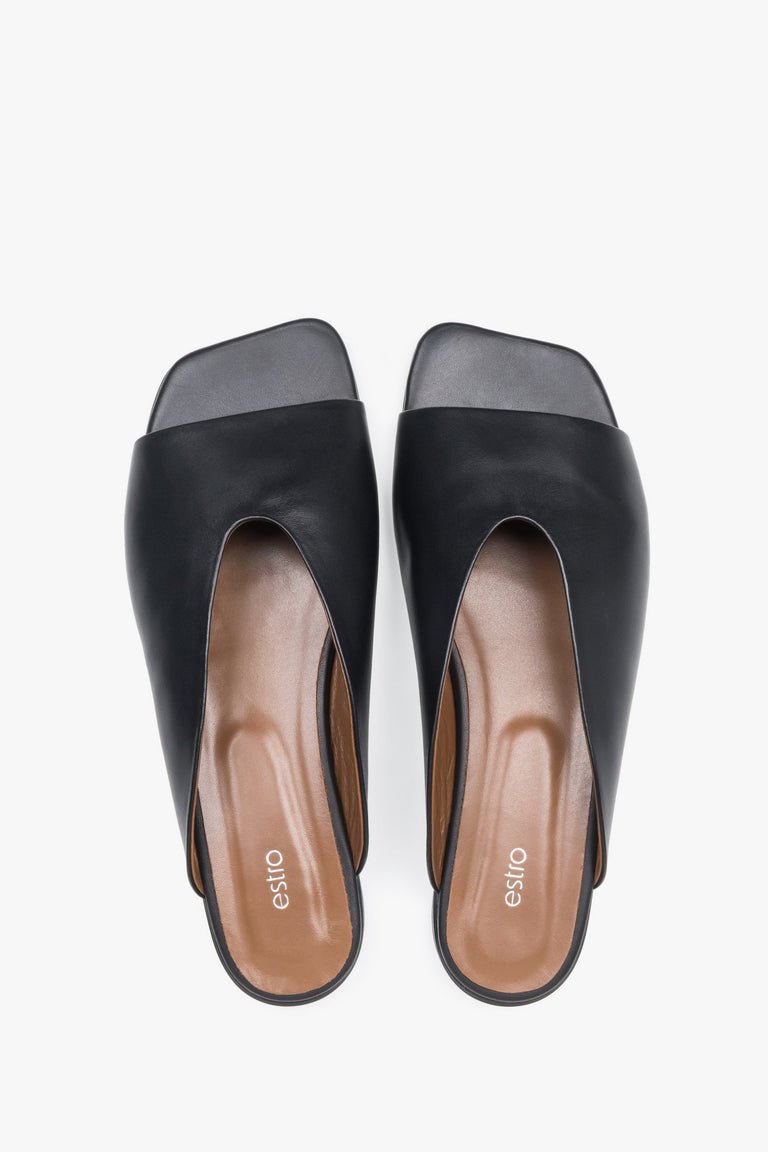 Top view of women's black leather flat mules by Estro