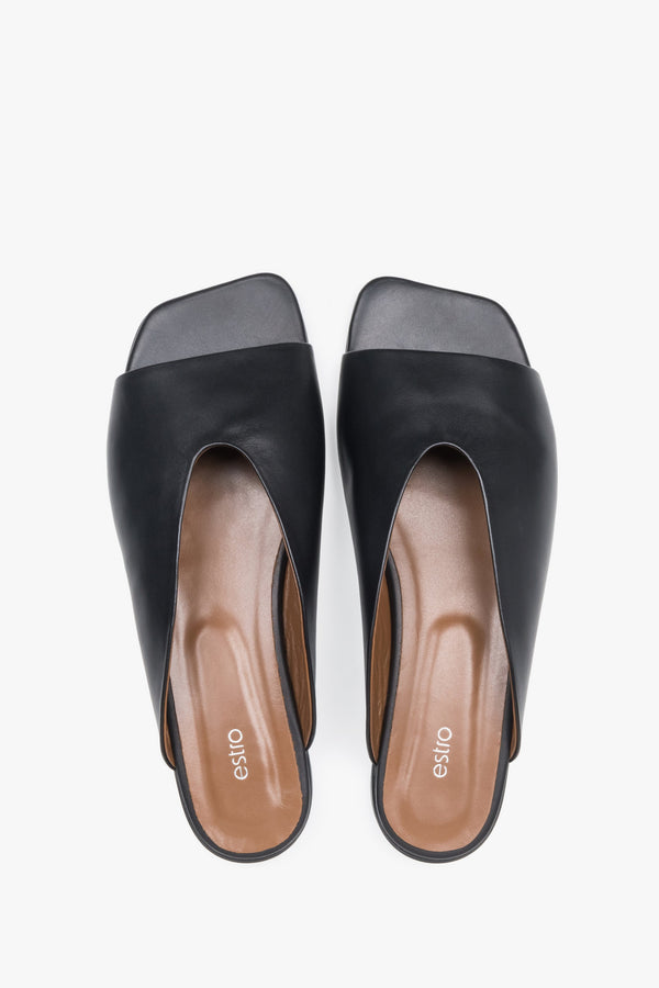 Top view of women's black leather flat mules by Estro