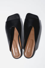 Top view of women's black leather flat mules with square toe by Estro