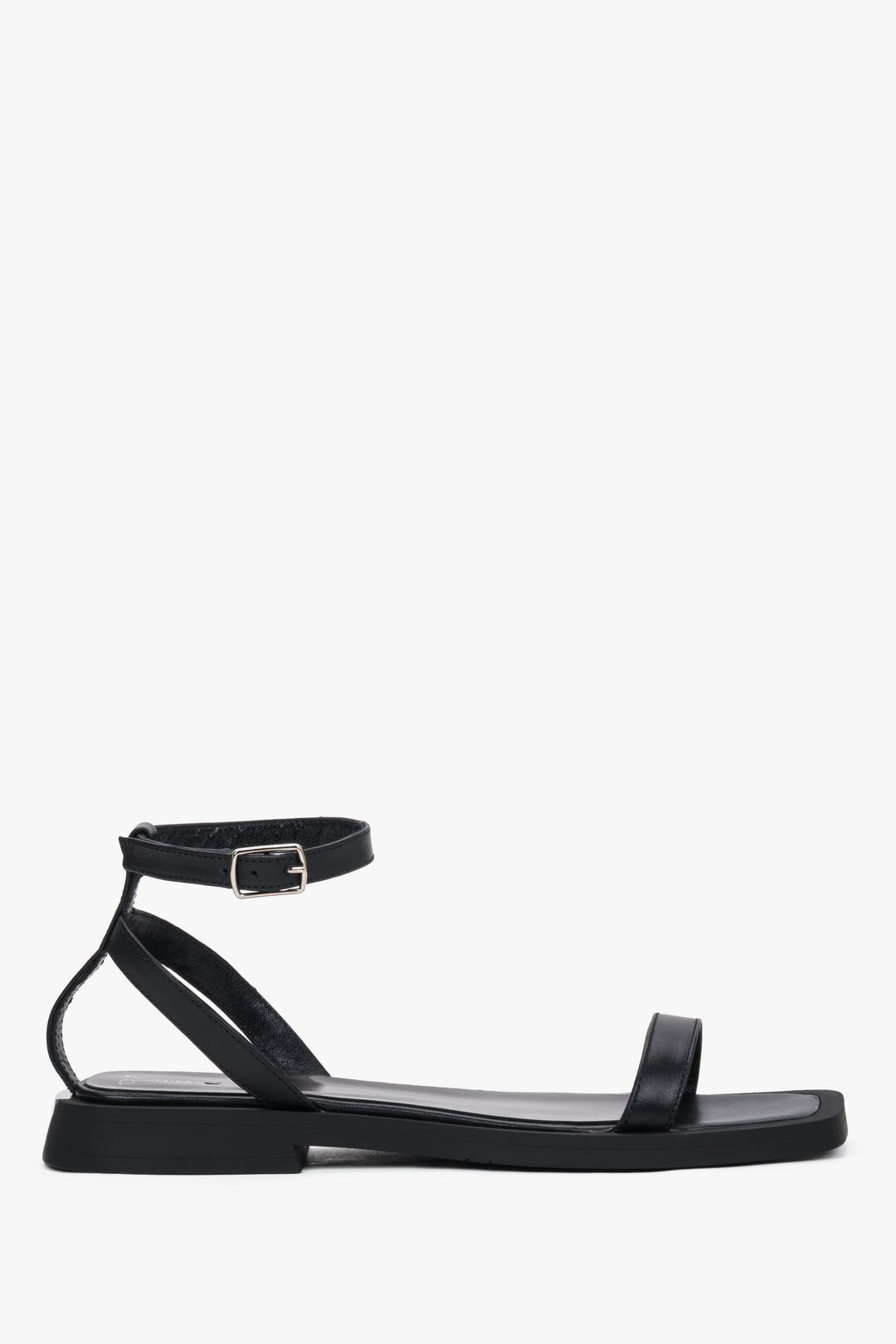 Women’s black leather flat sandals by Estro with thin straps.