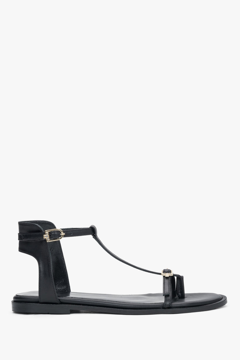 Women's black leather flat sandals with gold details by Estro