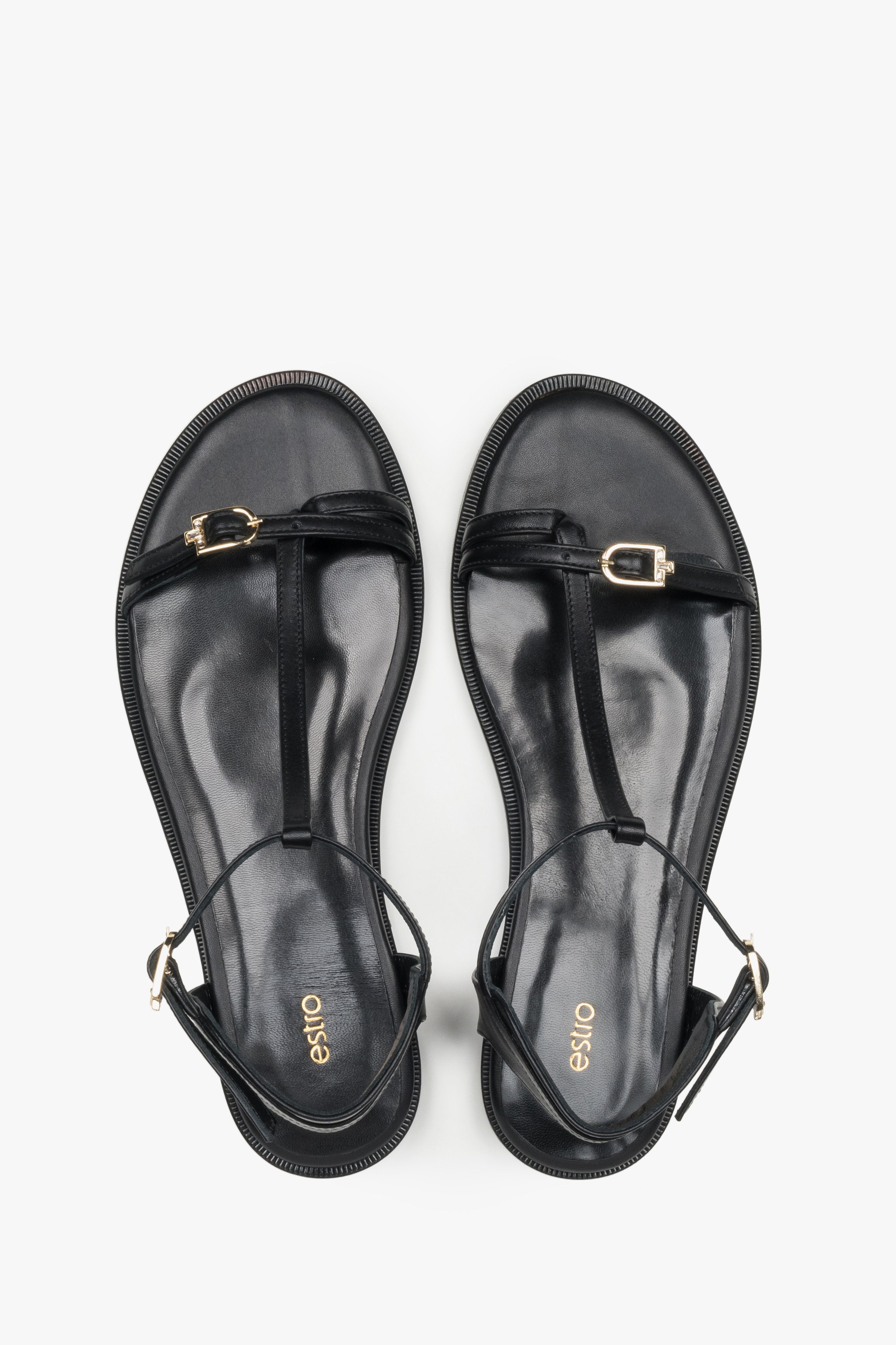 Top view of women's black leather flat sandals by Estro