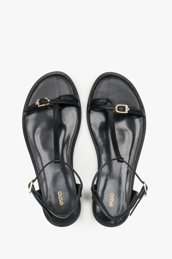 Top view of women's black leather flat sandals by Estro