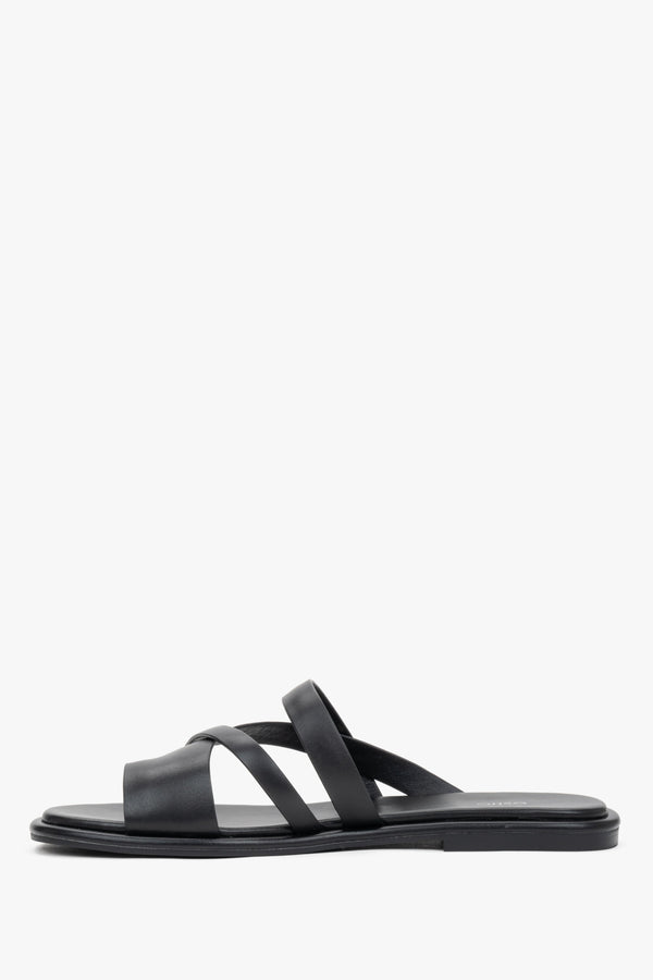 Elegant black genuine leather flat slides with a comfortable toe ring.