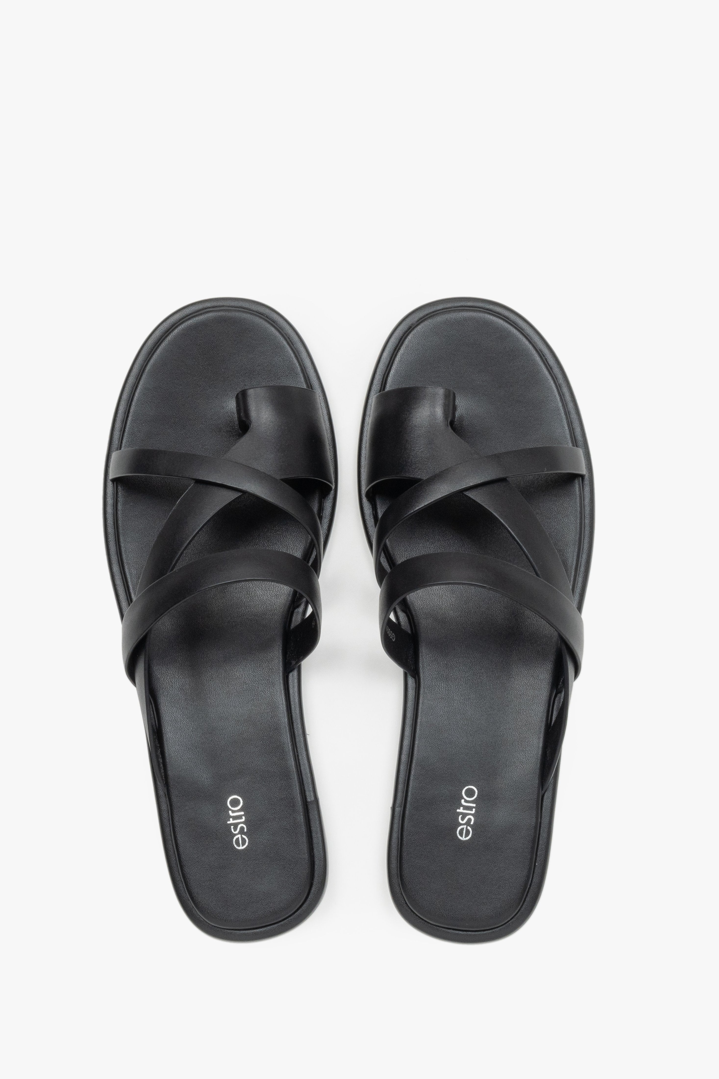 Women's minimalist black leather sandals with soft interwoven straps.