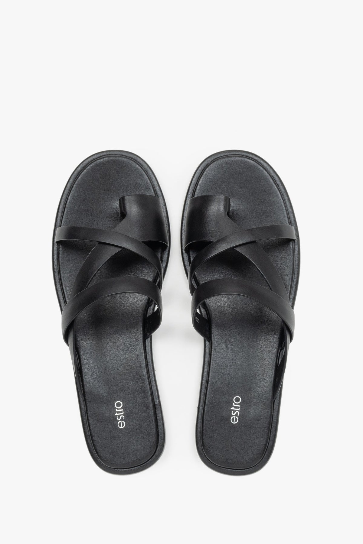 Women's minimalist black leather sandals with soft interwoven straps.