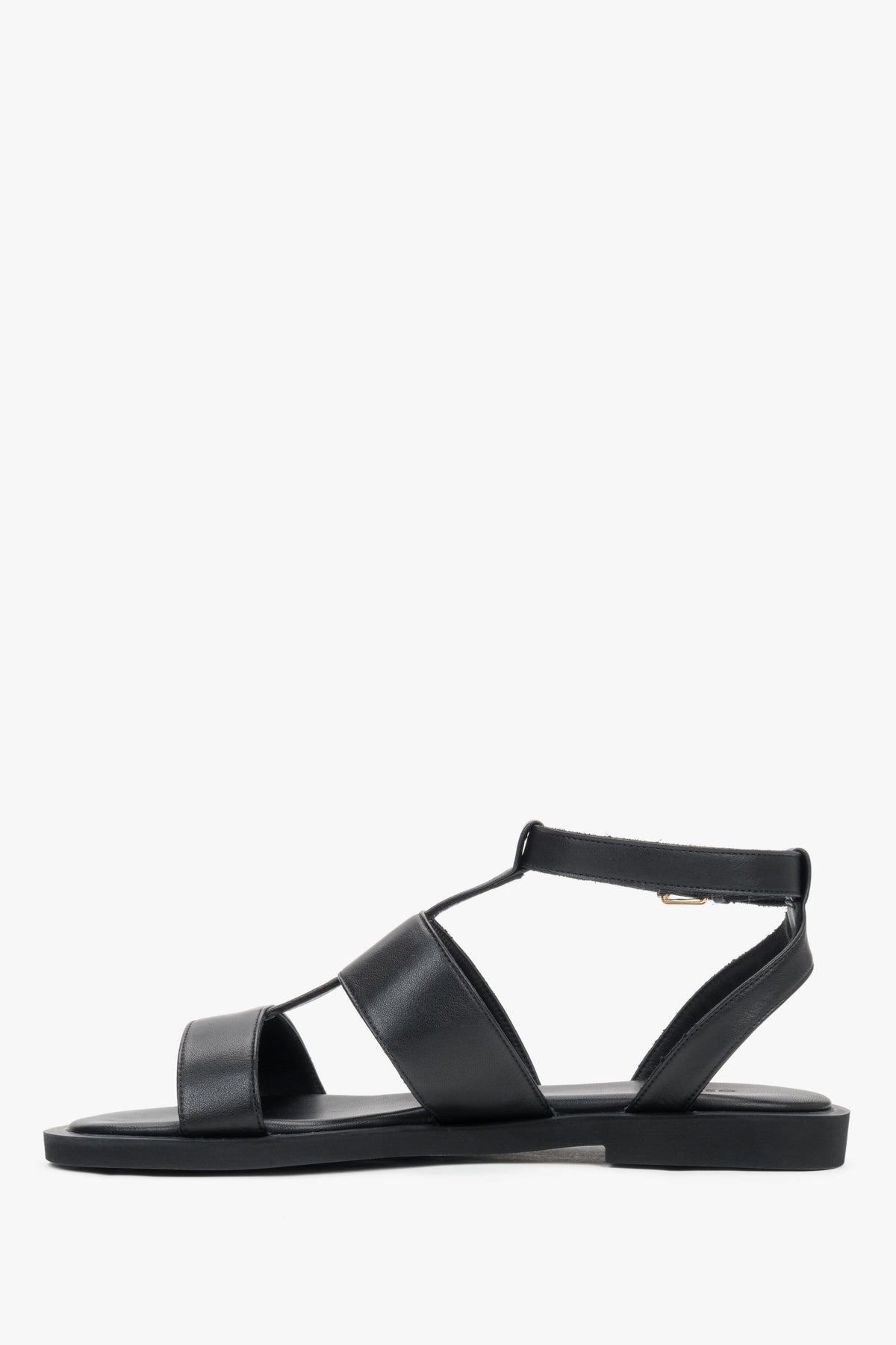Minimalist black leather sandals featuring a comfortable PU sole and buckle closure.