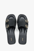 Women’s Black Leather Flat Slide Sandals with Gold Buckles Estro ER00119556.