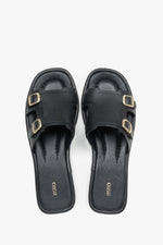 Women’s Black Leather Flat Slide Sandals with Gold Buckles Estro ER00119556.