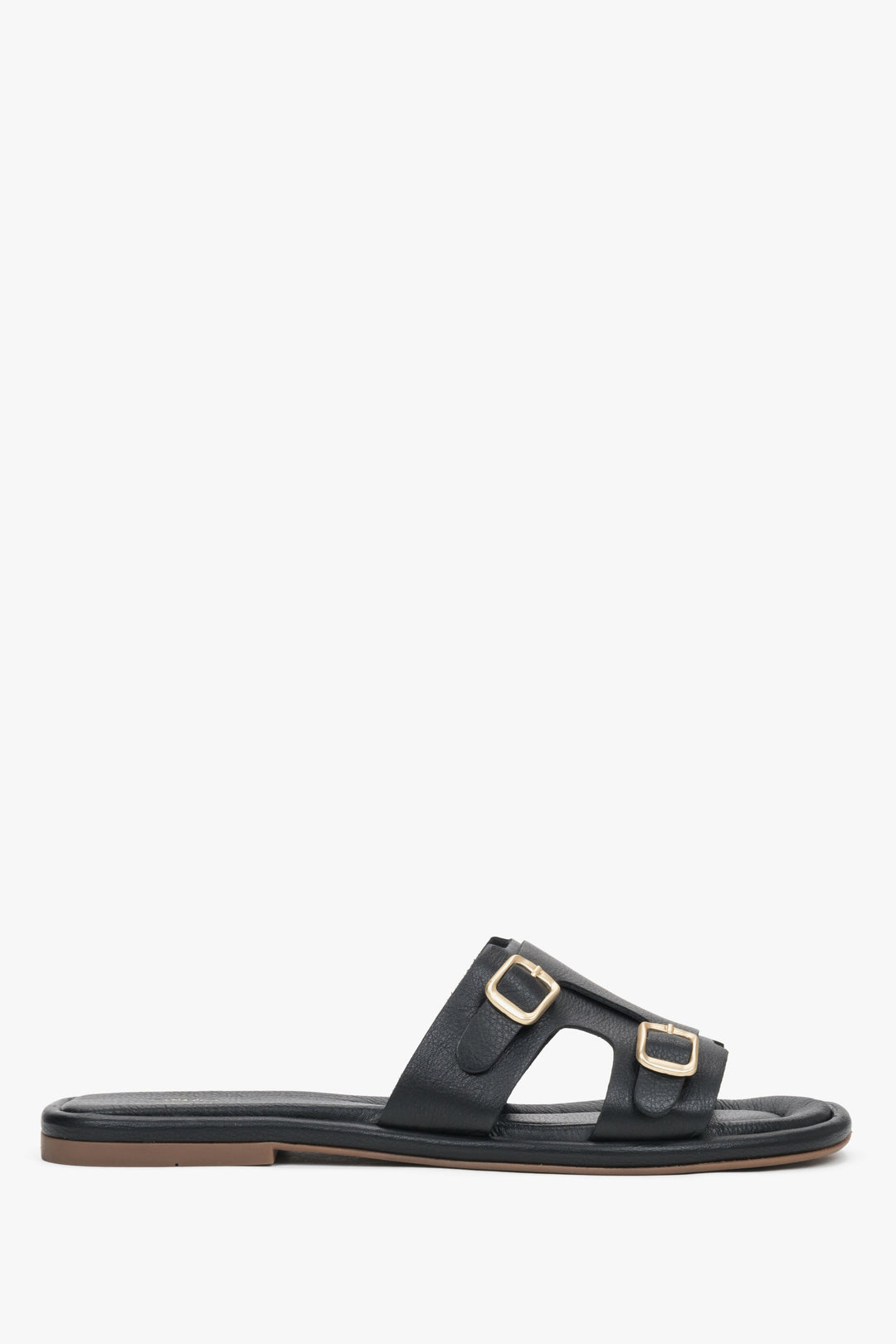 Women's black genuine leather slide sandals with large, decorative gold buckles Estro, showcasing a bold, elegant summer design.